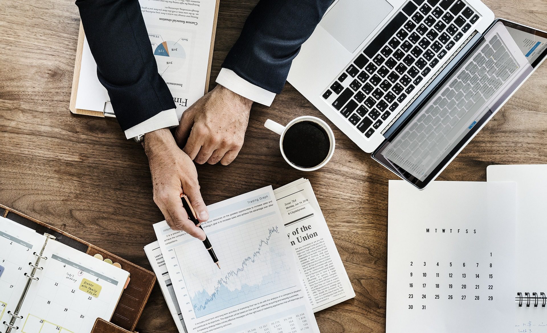 financial expert explaining graphs over desk