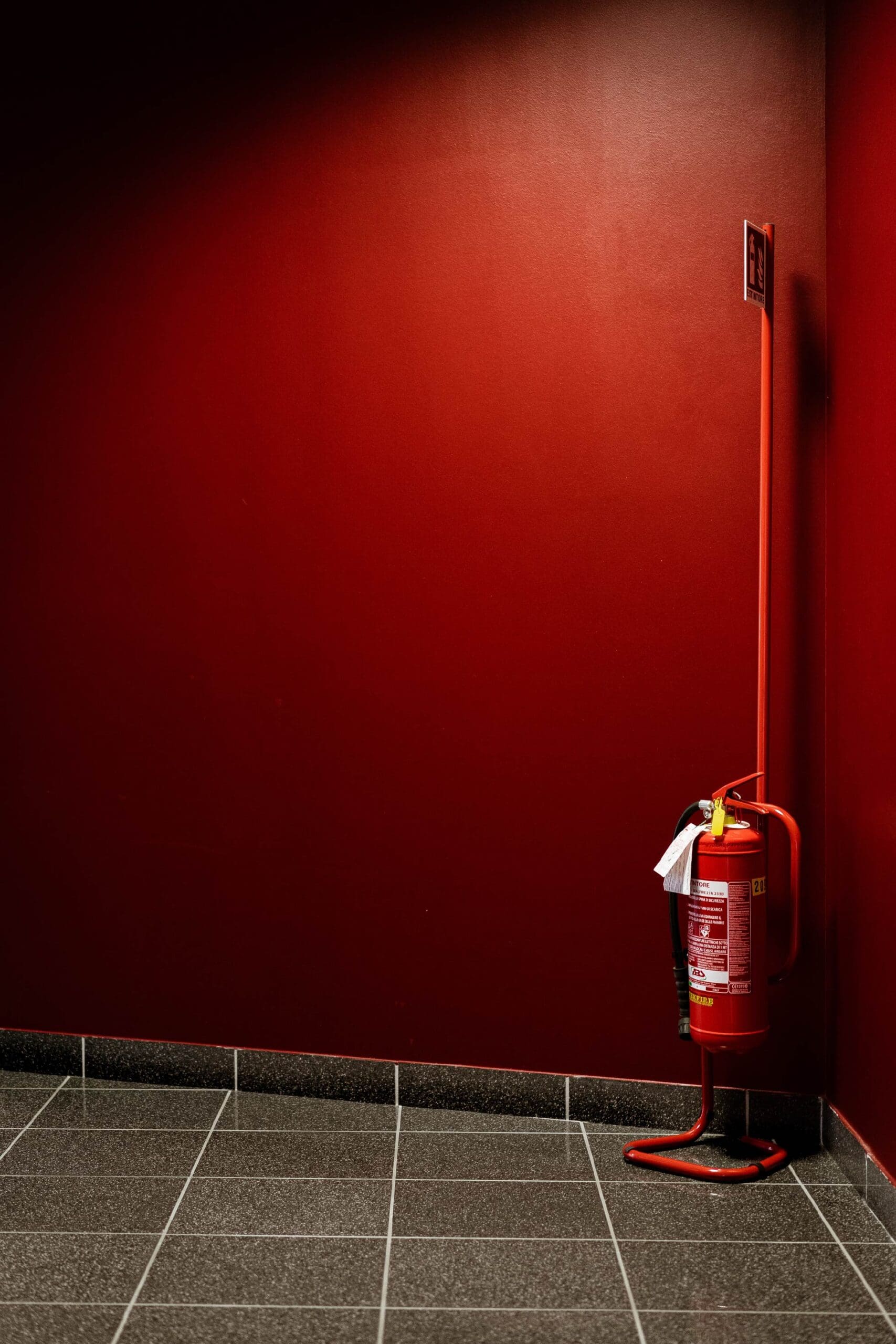 red fire hydrant next to wall